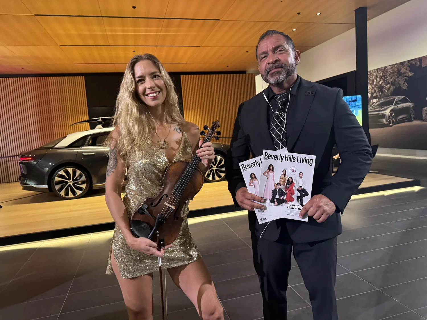 Elin Wolf at a Beverly Hills Living event with her violin